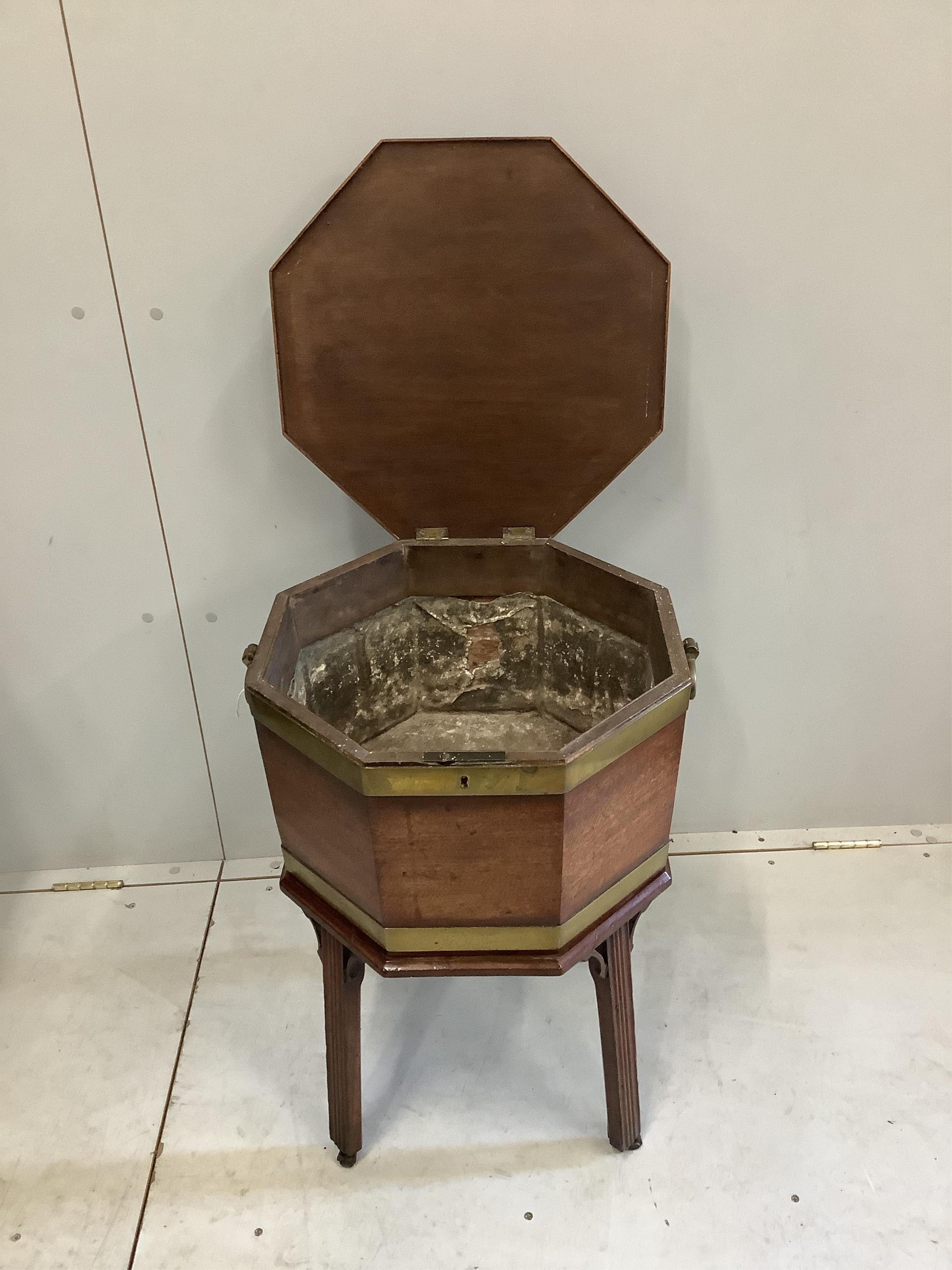 A George III and later mahogany brass bound octagonal wine cooler, width 50cm, height 63cm. Condition - good